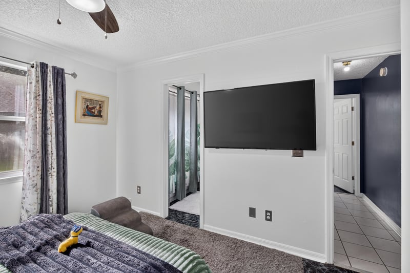 Bedroom with wall-mounted television at 1346 Gately Ct, Jacksonville, FL 32225