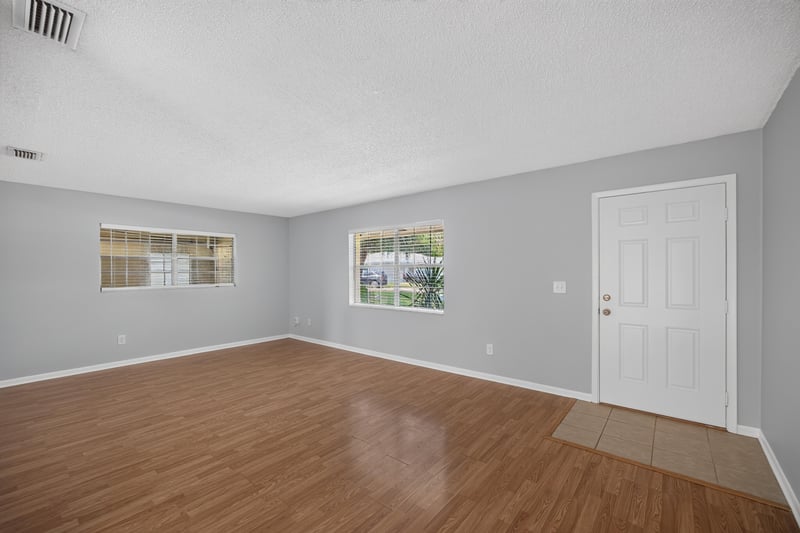Living room with window and door to garage at 328 Palos Ct, St. Augustine, FL