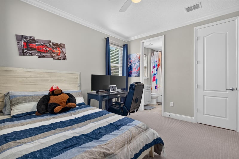 Bedroom with sports-themed decor at 22 Azura Point