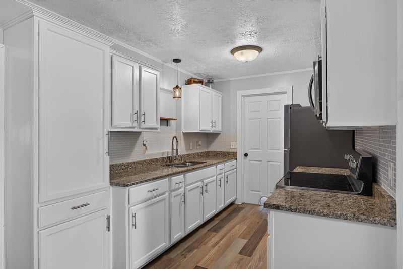 Kitchen with pendant lighting and granite island at 6757 Deer Springs Rd, Keystone Heights, FL 32656