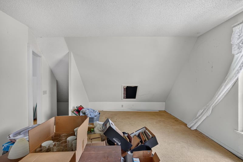 Attic storage room with stacked boxes at 1173 US-17, Satsuma, FL 32189