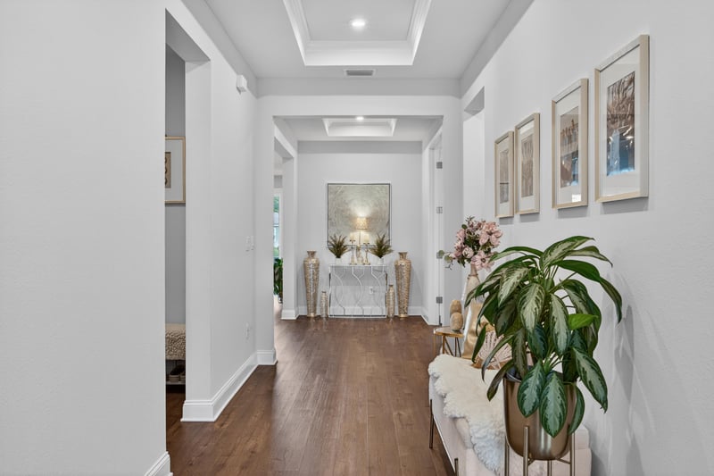 Entry hallway with wood floors leading to the living area at 85491 Fall River Pkwy, Fernandina Beach, FL 32034
