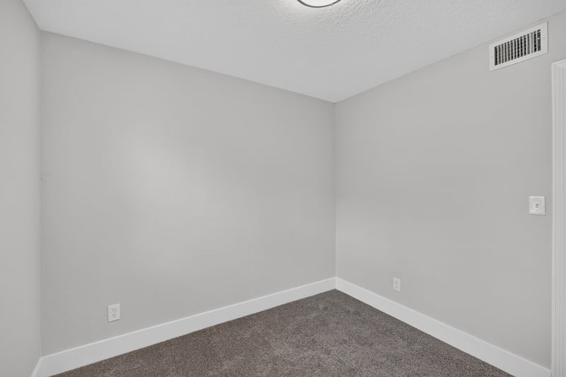 Empty carpeted room at 6238 Randia Dr, Jacksonville, FL 32210