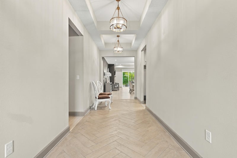 Entry hallway with tile flooring and pendant lighting at 3921 Spyglass Hill Ln