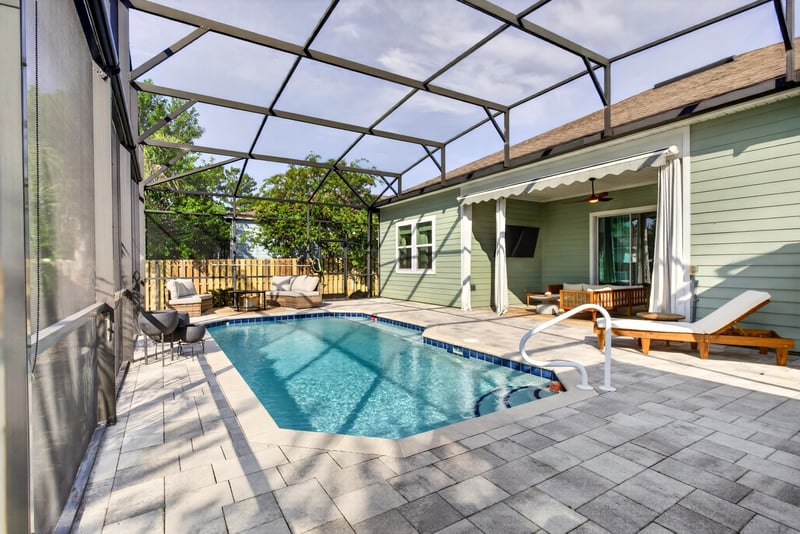 Pool with covered patio and furniture at 3328 Southern Oaks Dr, Green Cove Springs, FL 32043