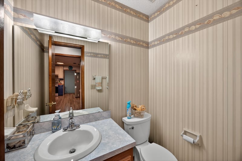 Bathroom vanity with tile wallpaper at 981 Marble Ridge Dr, Orange Park, FL 32065