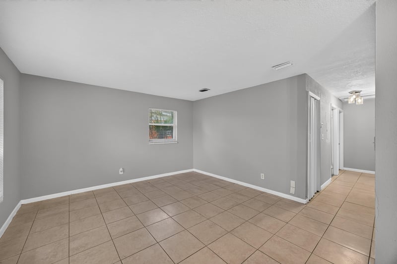 Empty living room with tile flooring at 4030 Leonard Cir W, Jacksonville, FL 32209