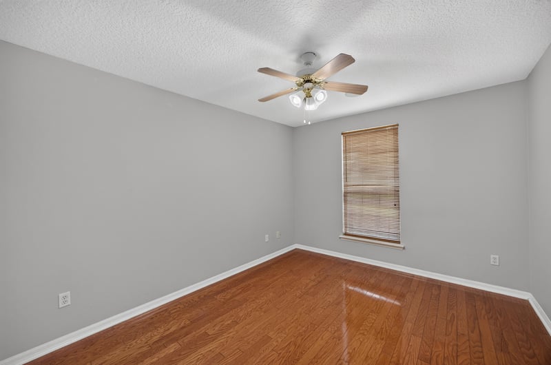 Bedroom with wood floor and window at 635 Wakeview Dr, Orange Park, FL 32065