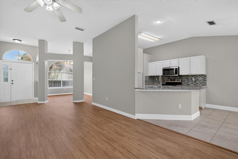 Kitchen opening to the living area at 12949 Chets Creek Dr S, Jacksonville, FL 32224