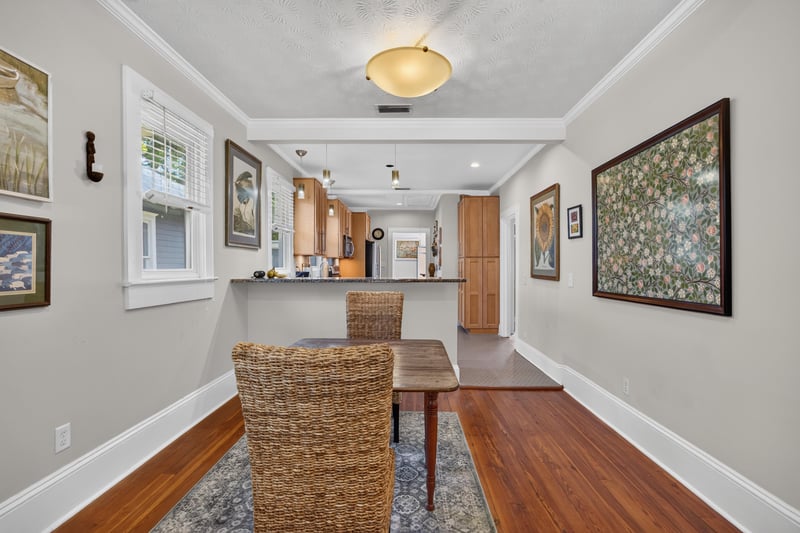 Dining room table with wicker chairs and hardwood floor at 1555 Belmonte Ave, Jacksonville, FL 32207