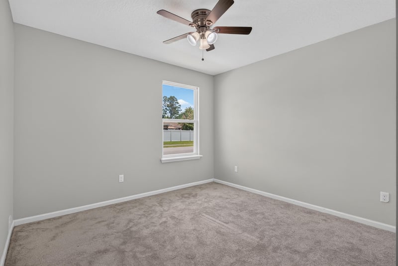 Bedroom with carpet flooring and natural light at 10066 Andean Fox Dr, Jacksonville, FL 32222