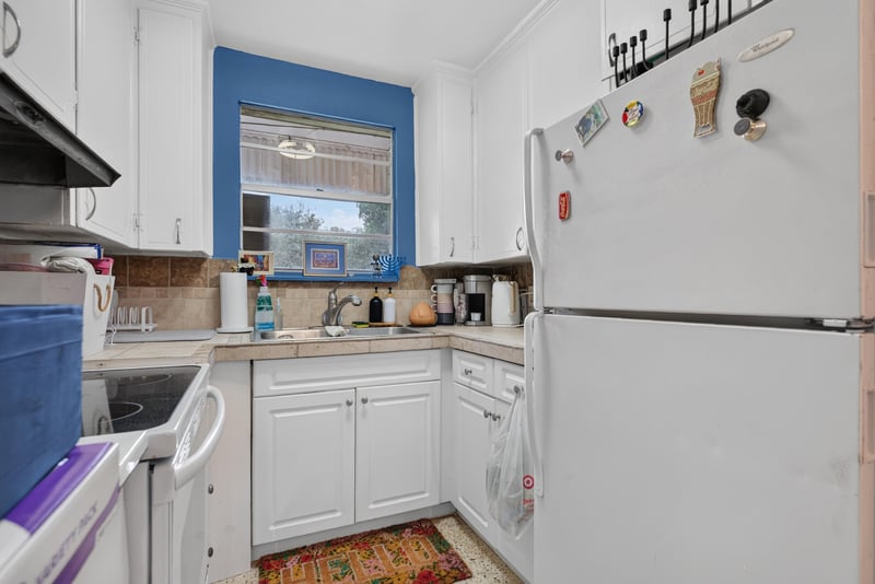 Kitchen with cabinets and refrigerator at 5745 110th St, Jacksonville, FL 32244