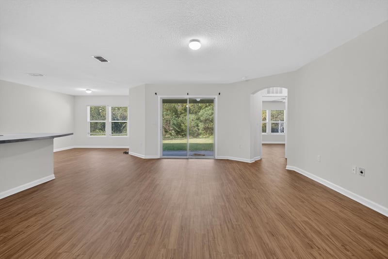 Living room with sliding glass door at 95221 Siena Ct, Fernandina Beach, FL 32034