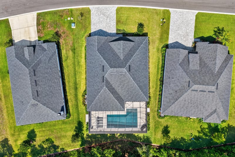 Aerial close-up of the roofline and pool enclosure at 785 Back Creek Dr, St. Augustine, FL 32092