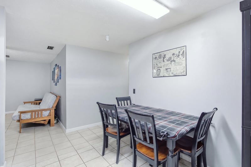Dining room with table, chairs and futon at 417 Capricorn Ln, Orange Park, FL 32073
