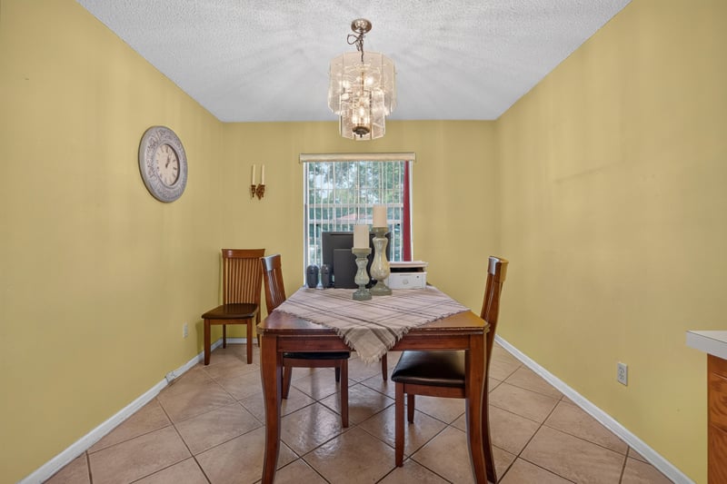 Dining room with yellow walls and window at 5375 Dodge Rd, Jacksonville, FL 32209