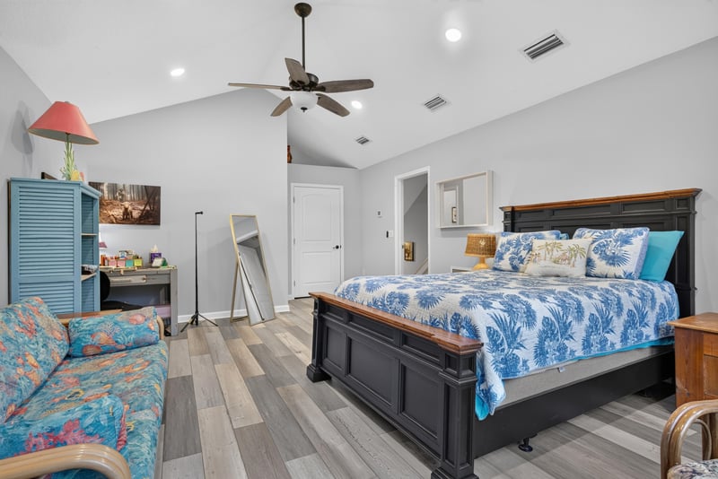 Bedroom with vaulted ceiling and seating area at 2304 Spring Hill Ct, Orange Park, FL