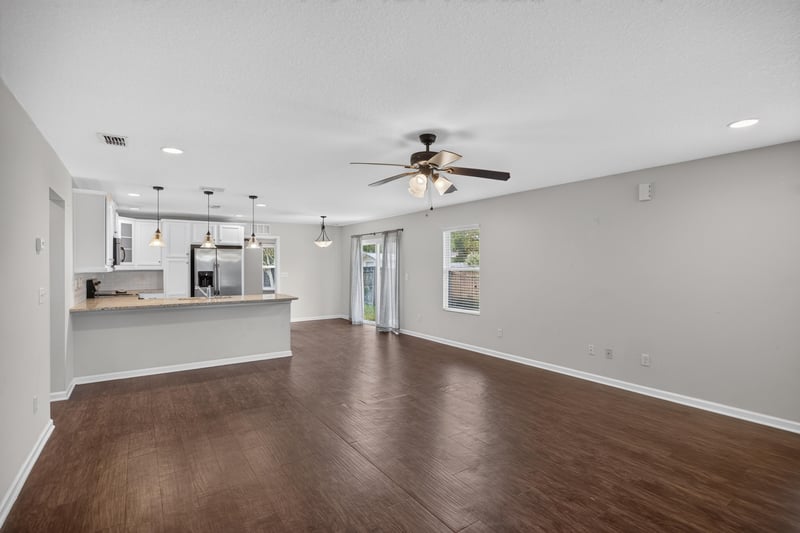 Open kitchen and living area with wood floors at 1002 Ingleside Ave, Jacksonville, FL 32205