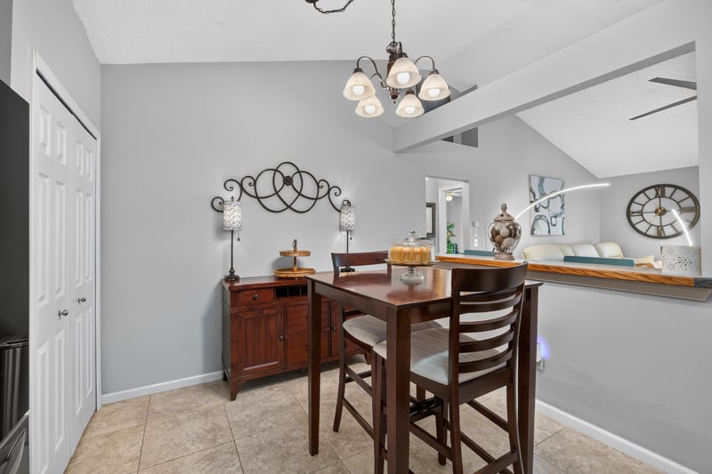 Dining area with wood table and chairs at 3067 Wavering Ln, Middleburg, FL 32068