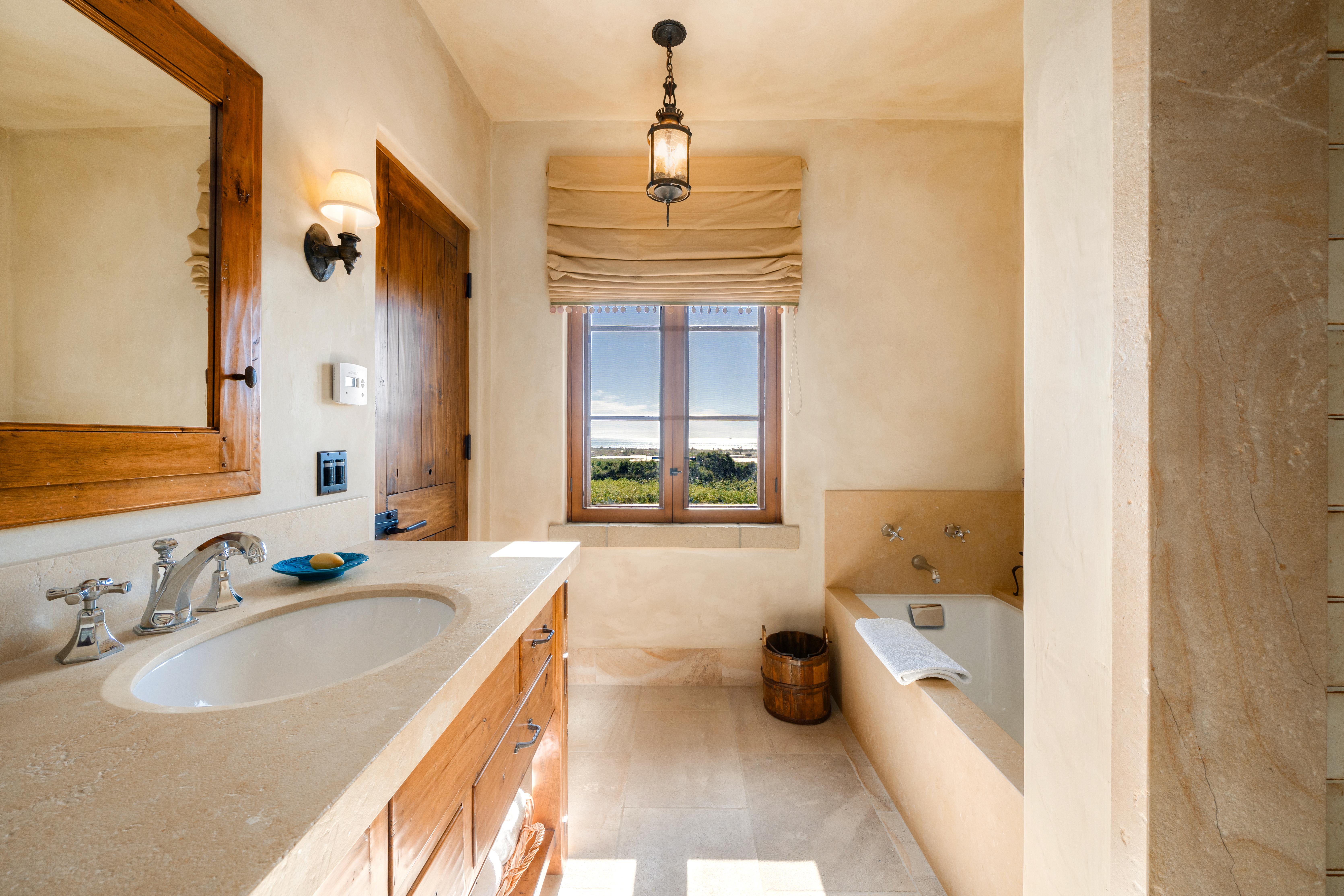 Professional real estate photography of grand interior living spaces at 1915 Monte Alegre Dr, Carpinteria — warm natural light and architectural scale define this exceptional Carpinteria bluffs residence. Our team captured editorial photography, aerial drone photography via Inspire 3 Cinema Drone, a cinematic property video, a true vertical social media reel, and twilight photography from midday through twilight.