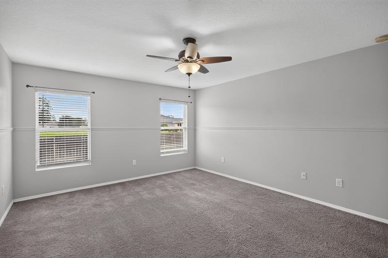 Empty bedroom with carpet and windows at 7545 Lirope St, Jacksonville, FL 32244
