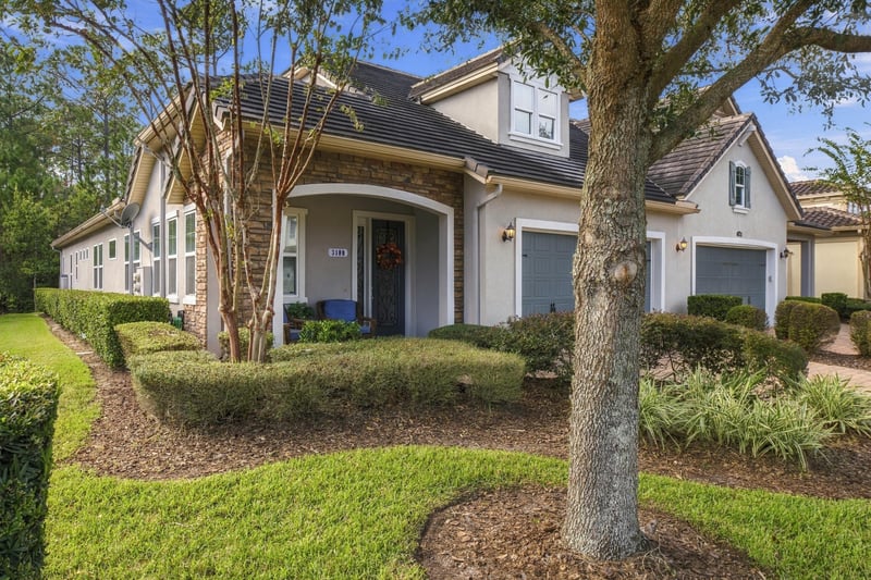 Front exterior view through landscaping, photographed by Megapixeler on Lucena Ln, Jacksonville, FL