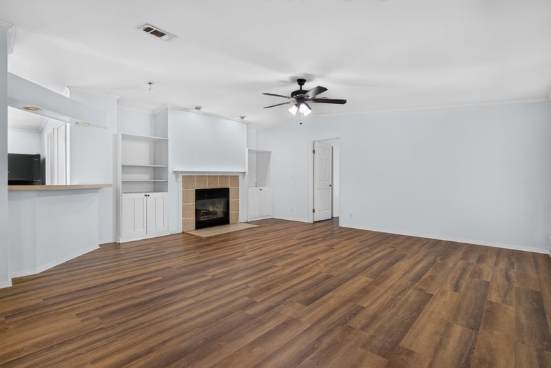 Living room with fireplace and wood-look flooring at 3215 Robin Ln, Middleburg, FL