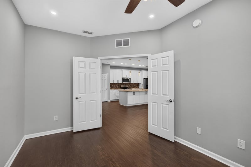 Bedroom with doors open to kitchen at 11251 Campfield Dr unit 4209, Jacksonville, FL 32256