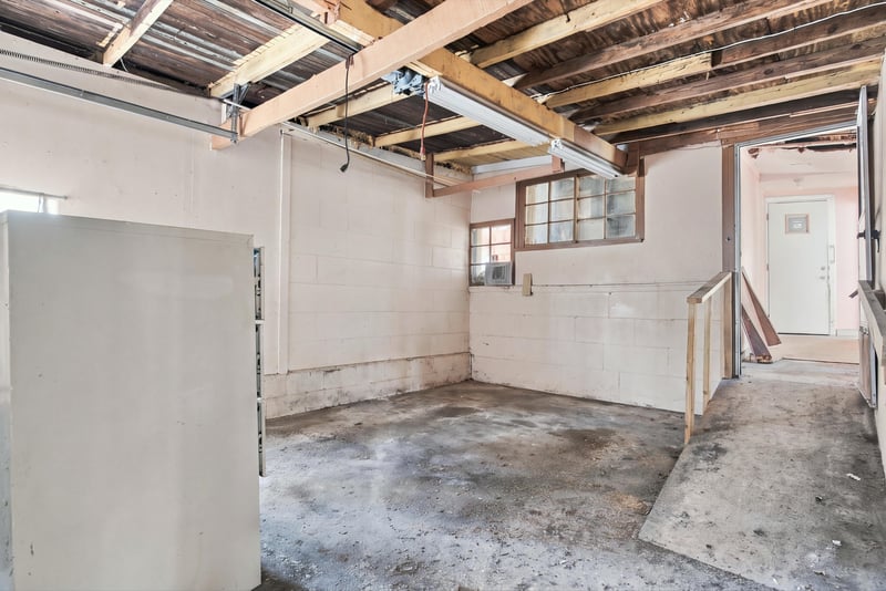 Unfinished room with exposed ceiling and stairway at 1807 Idlewild Ave, Green Cove Springs, FL