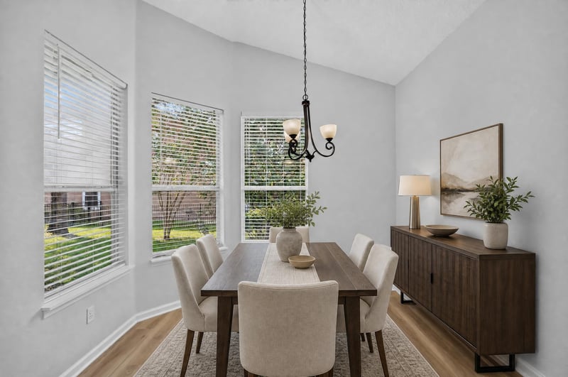 Dining area virtually staged with table and console at 3101 E Banister Rd, St. Augustine, FL 32092
