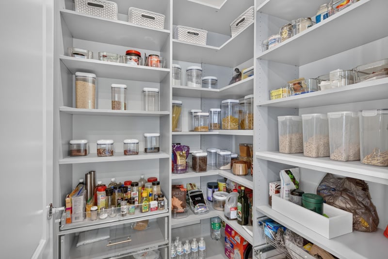 Pantry with built-in shelving at 22 Azura Point