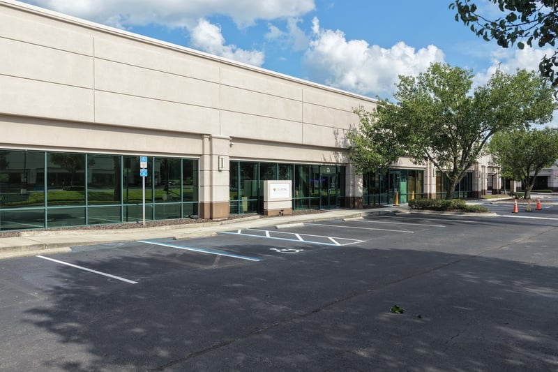 Building front with large glass storefront windows at 10550 Deerwood Park Blvd, Jacksonville, FL 32256