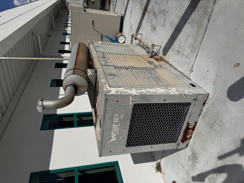 Older rooftop air conditioning condenser unit at 11700 New Kings Rd, Jacksonville, FL 32219