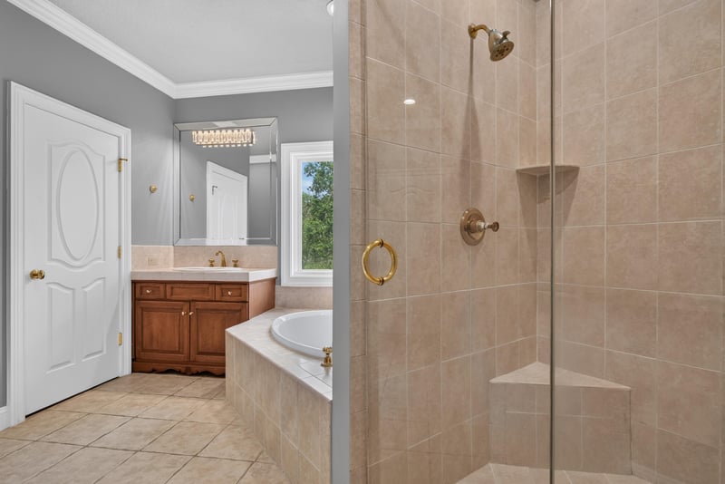Bathroom with tub and glass shower at 344 Broward Rd, Jacksonville, FL