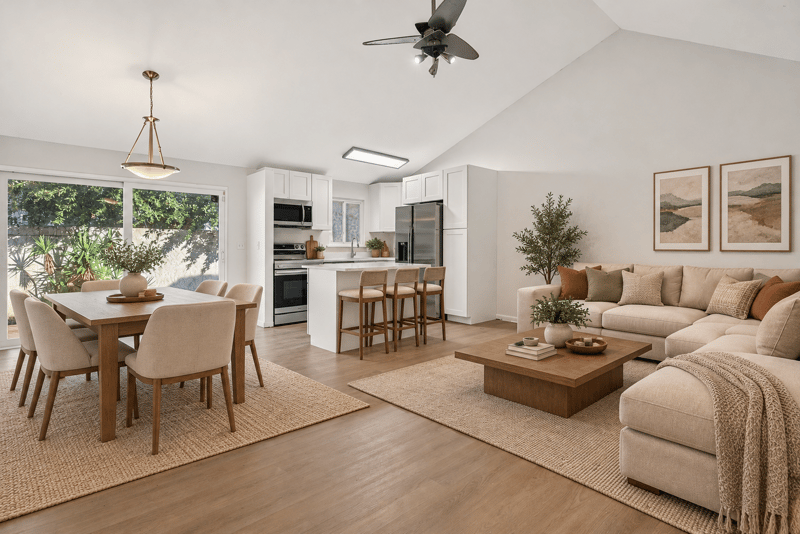 Open living, dining and kitchen area, vaulted ceiling, virtually staged at 8177 Virgo St, Jacksonville, FL 32216