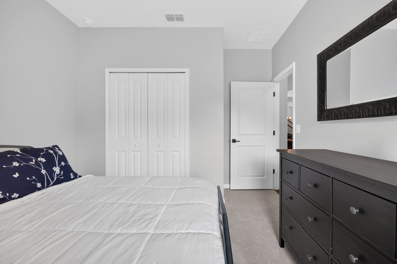 Bedroom with star bedding and closet door at 2354 Jennings Farm Dr, Middleburg, FL 32068