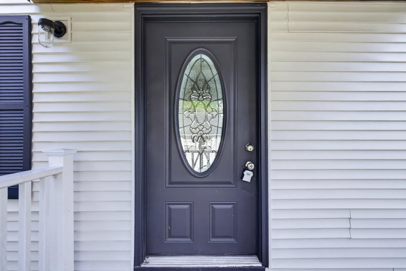 Front door detail with glass panel at 4565 Appleton Ave, Jacksonville, FL