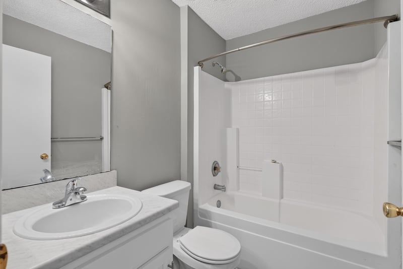Bathroom with tub-shower and pedestal sink at 1108 Hidden Cove Cir S, Atlantic Beach, FL 32233