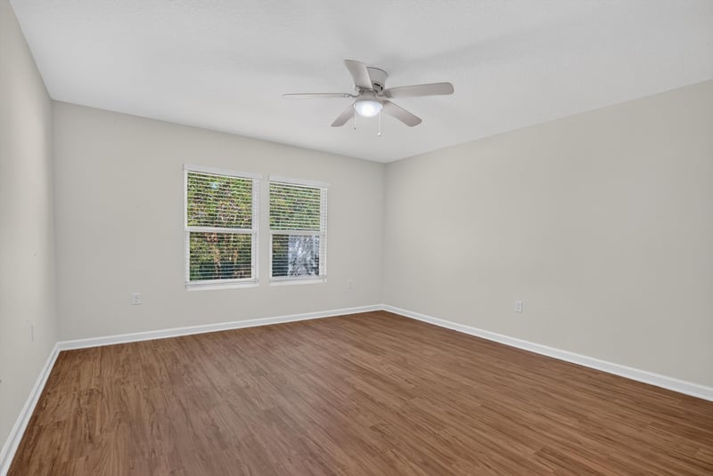 Bedroom with window and ceiling fan at 95221 Siena Ct, Fernandina Beach, FL 32034