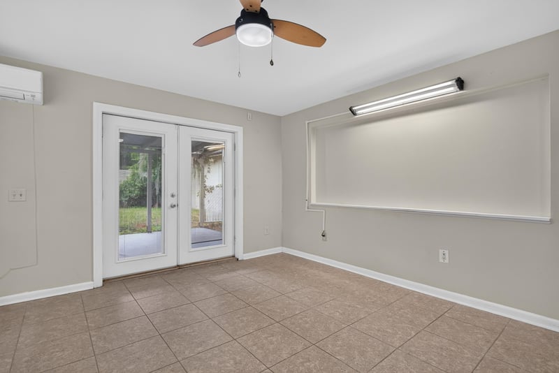 Room with tile floor and French doors at 217 Baisden Rd, Jacksonville, FL 32218