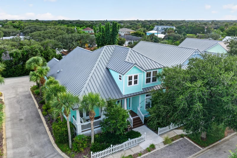 Aerial view of the home among trees at 117 Island Cottage Way, St. Augustine, FL 32080
