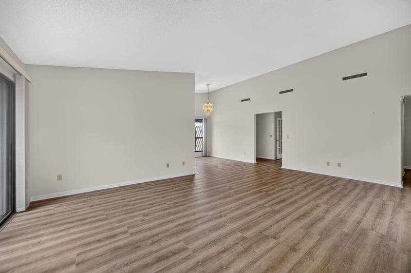 Living room view with vaulted ceiling at 3407 Fairbanks Grant Rd N, Jacksonville, FL 32223