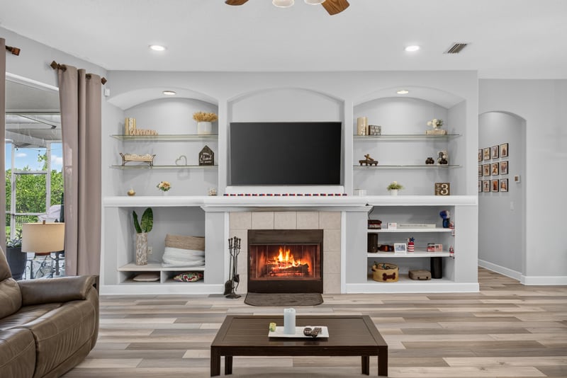 Living room built-ins with TV and fireplace at 2304 Spring Hill Ct, Orange Park, FL