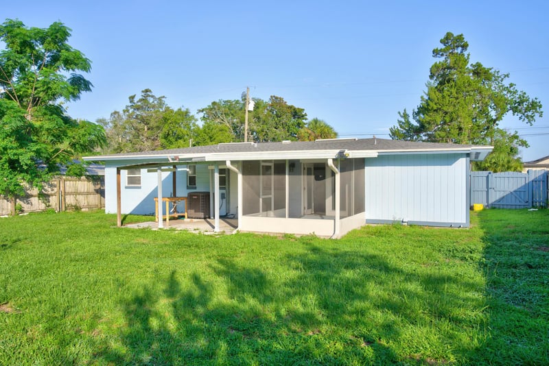 Back exterior with screened porch and yard at 442 Ameca Ave, Orange Park, FL 32073