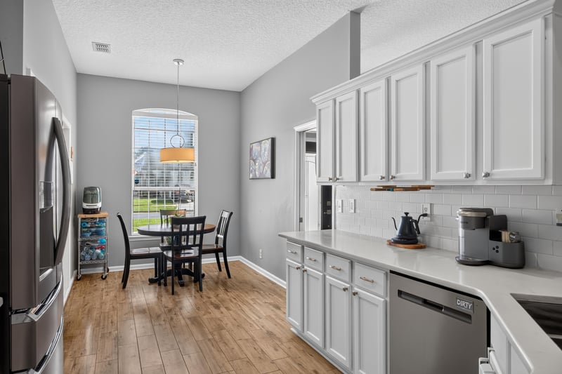 Kitchen with window over sink and dining table visible at 12825 Kelsey Island Dr, Jacksonville, FL 32224