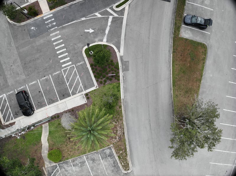 Aerial view of parking lot and landscaped bed at 9406 Atlantic Blvd, Jacksonville, FL 32225