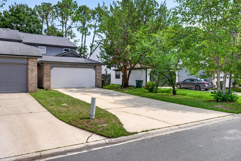 Front exterior with walkway, driveway and landscaping at 4427 Millstone Ct, Jacksonville, FL