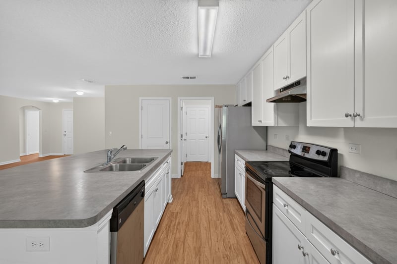 Kitchen view toward hallway and doors at 95221 Siena Ct, Fernandina Beach, FL 32034