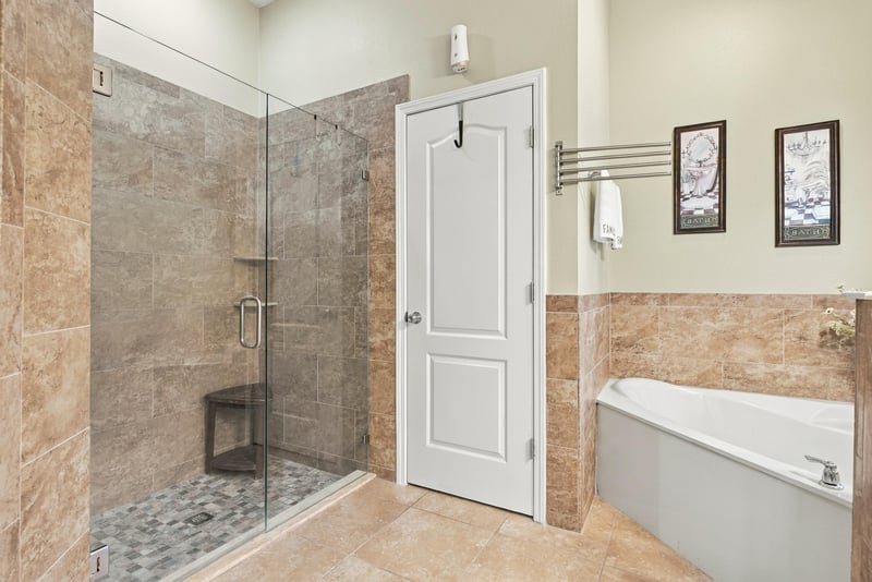 Primary bathroom with glass shower and tile at 10923 Black Diamond Ct, Jacksonville, FL