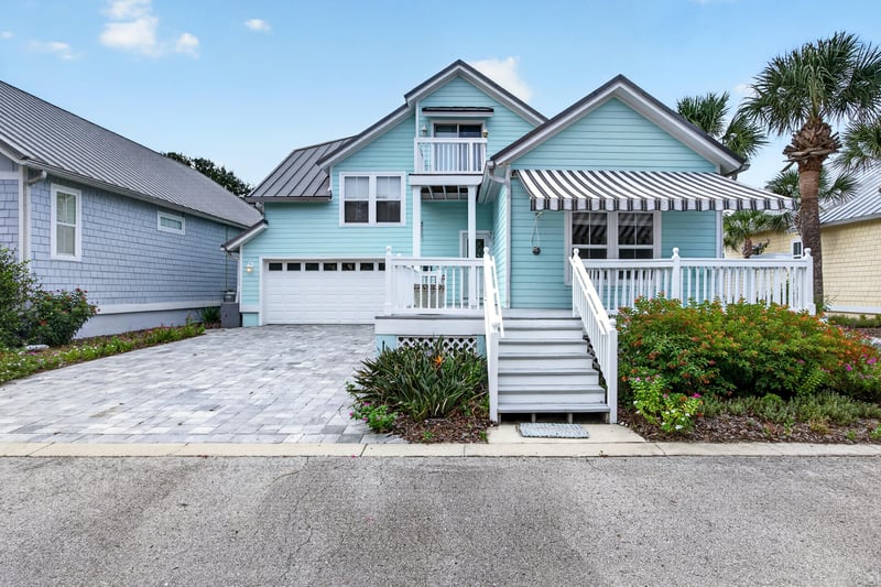 Front exterior with driveway and garage at 117 Island Cottage Way, St. Augustine, FL 32080